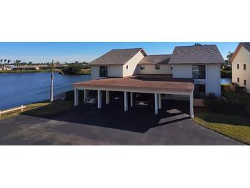 Waterfront condo building with carport and beautiful lake views at 1783 Lake Pl # 1783A, Venice, FL 34293