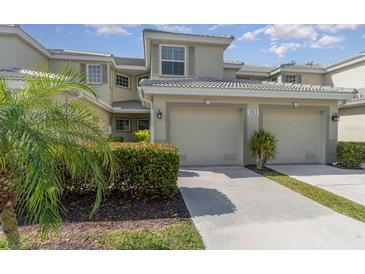 Attractive two-story condo with two-car garage and lush landscaping at 3353 Grand Vista Ct # 202, Port Charlotte, FL 33953