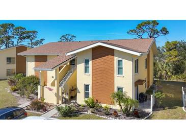 Two-story condo with attractive landscaping and a private patio at 6699 San Casa Dr # T1, Englewood, FL 34224