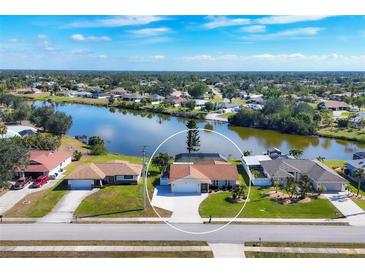 Aerial view of single-Gathering home with water access at 7398 Spinnaker Blvd, Englewood, FL 34224