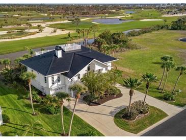 Luxury home with golf course views and a large backyard at 9860 Eagle Preserve Dr, Englewood, FL 34224