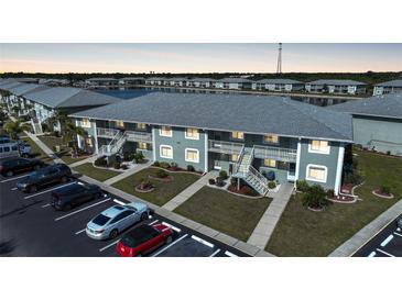 Aerial view of condo building near water with parking at 3310 Loveland Blvd # 802, Punta Gorda, FL 33980