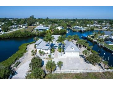 Waterfront home with private dock and lush landscaping at 1112 Andrews St, Englewood, FL 34224