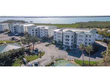 Scenic condos feature lush landscaping, tennis court, ample parking, and views of the bay at 9203 Griggs Rd # 301, Englewood, FL 34224