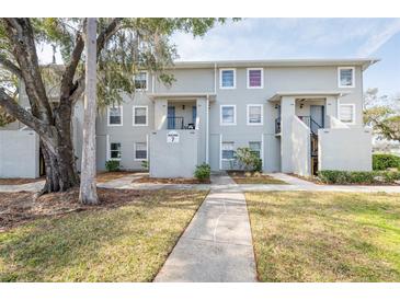 Two-story building with multiple units and a walkway at 7182 E Bank Dr # 7-103, Tampa, FL 33617