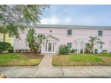 Pink building exterior with landscaping and walkway at 190 Pompano Se Dr # A, St Petersburg, FL 33705