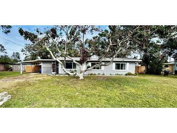 Charming single story home with a large front yard and mature trees at 129 Gulf Ave, Nokomis, FL 34275