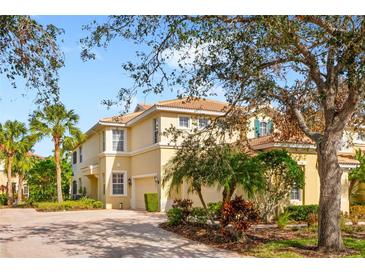 Attractive three-story home with a two-car garage and lush landscaping at 9607 Sea Turtle Ter # 101, Bradenton, FL 34212