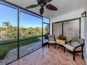 Relaxing screened patio overlooking a tranquil waterway at 1100 Capri Isles Blvd # 212, Venice, FL 34292