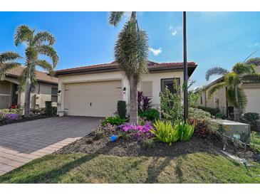 Single-story home with attached garage and landscaped front yard at 125 Soliera St, Nokomis, FL 34275