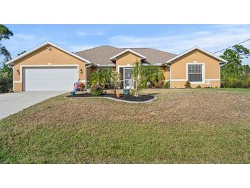 Attractive single-story house with a large front yard and attached garage at 13156 Dodds Ct, Port Charlotte, FL 33953