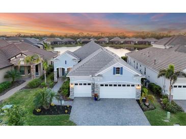Luxury home with lake view in a gated community at 13072 Steinhatchee Loop, Venice, FL 34293