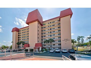 Condo building with red roof, ample parking, and a desirable location at 244 Saint Augustine Ave # 805, Venice, FL 34285