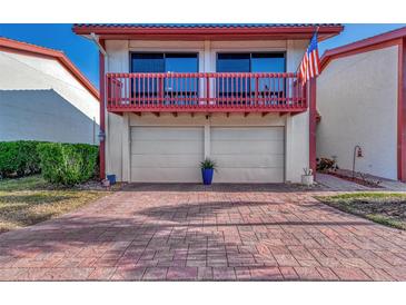 Inviting exterior with double garage and brick paver driveway at 738 Sorrento Inlt # 738, Nokomis, FL 34275