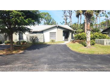 Cute condo with a private fenced yard and driveway at 112 Jose Gaspar Dr # 112, Englewood, FL 34223