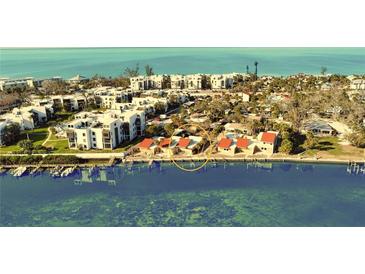 Aerial view of waterfront property with private docks and stunning water views at 2985 N Beach Rd # C8-1, Englewood, FL 34223