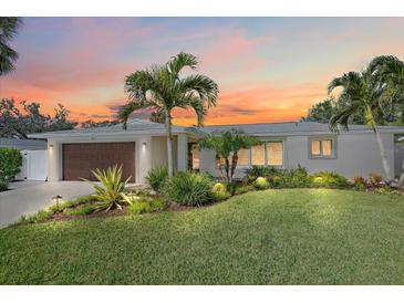 Attractive single-story home with a landscaped yard and a modern facade at 712 Cadiz, Venice, FL 34285