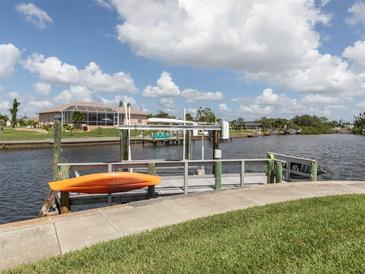 Private dock with kayak and beautiful water views at 335 Englewood Isles Pkwy # 55, Englewood, FL 34223
