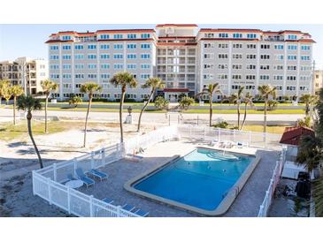 Communal swimming pool with surrounding lounge area at 500 The Esplanade N # 306, Venice, FL 34285