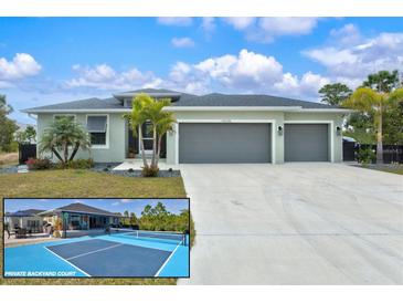 Inviting home featuring a spacious three-car garage and beautiful landscaping, including palm trees and a private backyard court at 14098 Baracoa Ln, Port Charlotte, FL 33981