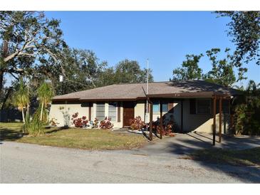 Single story home with carport and landscaping at 451 Home Park Rd, Venice, FL 34285