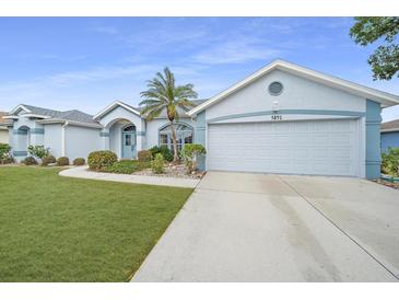 House exterior with attached garage and landscaping at 5891 Madison Rd, Venice, FL 34293