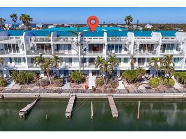 Aerial view of waterfront property with private docks at 8230 Harborside Cir, Englewood, FL 34224