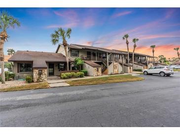 Ground level condo building with attractive landscaping and ample parking at 927 Capri Isles Blvd # 7, Venice, FL 34292