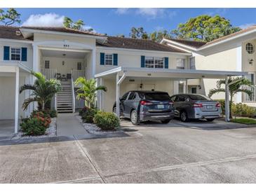 Well-maintained condo building with designated parking and lush landscaping adds curb appeal at 805 Montrose Dr # 203, Venice, FL 34293