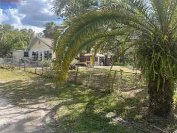 Charming single-Gathering home featuring a spacious yard and mature landscaping at 964 1St Dirt Rd, Venice, FL 34292