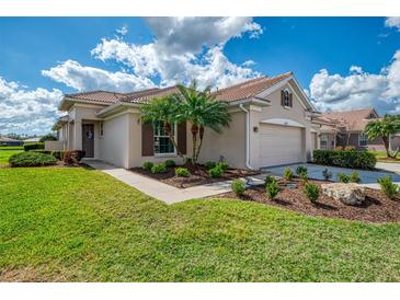 Charming single Gathering home with a well manicured lawn, and two car garage at 5371 White Ibis Dr, North Port, FL 34287