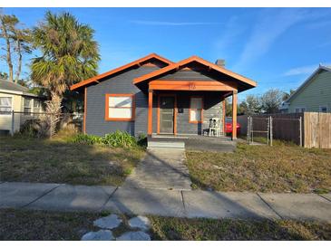 Charming bungalow featuring eye-catching two-tone colors and a cozy front porch at 510 26Th St S, St Petersburg, FL 33712