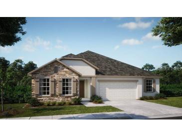 One-story home with stone accents and a two-car garage at 25488 Calusa Dr, Punta Gorda, FL 33955