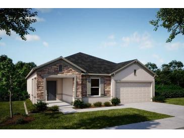Two-story house with stone accents and a two-car garage at 25533 Calusa Dr, Punta Gorda, FL 33955