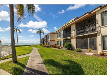 Condo building with water views and lush landscaping at 6268 Palma Del Mar S Blvd # 204, St Petersburg, FL 33715