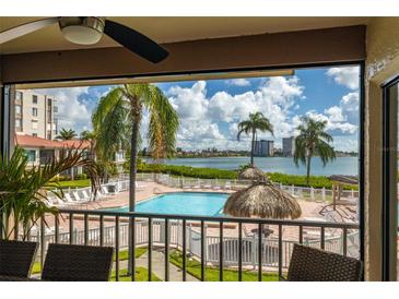 Stunning view of the bay, pool, and resort amenities from private balcony at 6268 Palma Del Mar S Blvd # 204, St Petersburg, FL 33715