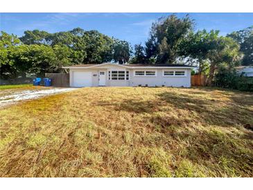 Updated single-story home with a large yard and driveway at 4185 Barracuda Se Dr, St Petersburg, FL 33705