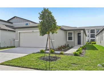 Charming curb appeal with well-maintained lawn and landscaping at 444 Lazy Shore Dr, Nokomis, FL 34275