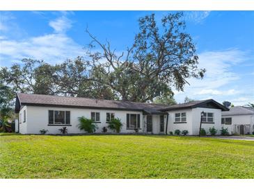Charming ranch home with a well-manicured lawn at 5818 18Th S Ave, Gulfport, FL 33707