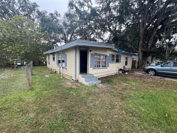 Cute yellow house with small front porch at 855 St Francis St, Brooksville, FL 34601