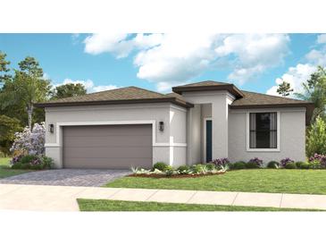 Single-story home with a two-car garage and attractive landscaping at 14370 Hammock Oak St, Parrish, FL 34219