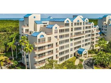 Multi-story building with blue roofs and waterfront views at 2333 Feather Sound Dr # A101, Clearwater, FL 33762