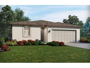 One-story home with attached garage and landscaped lawn at 14116 Gunnison Cv, Parrish, FL 34219