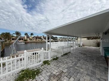 Spacious patio overlooking the canal, perfect for outdoor entertaining at 4113 Floramar Ter, New Port Richey, FL 34652