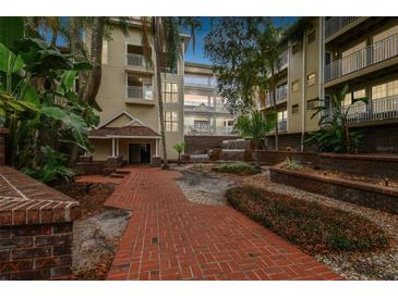 Granite countertops and white cabinets in this updated kitchen at 1000 W Horatio St # 312, Tampa, FL 33606
