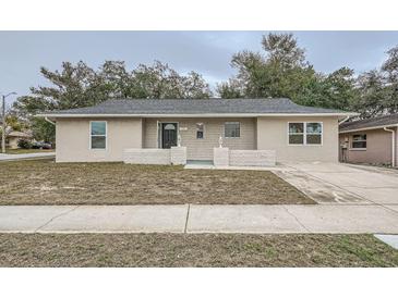 Charming single-story home with a well-maintained lawn and driveway at 11606 Nature Trl, Port Richey, FL 34668