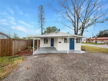 Updated home exterior with a covered carport and landscaped yard at 5466 9Th N Ave, St Petersburg, FL 33710