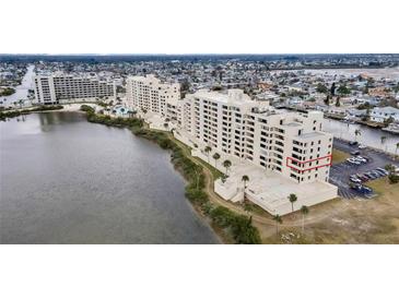 Aerial view of waterfront condo building showcasing its location and amenities at 5915 Sea Ranch Dr # 315, Hudson, FL 34667