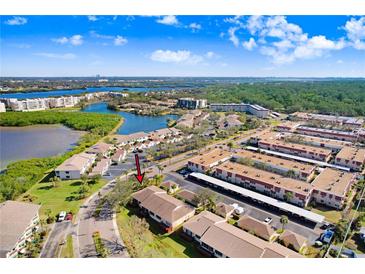 Aerial view showcasing a condo community near water at 6650 100Th N Way # 25C, St Petersburg, FL 33708