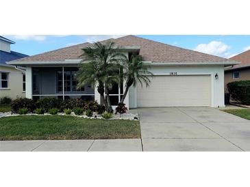 Single-story home with attached garage, palm trees, and well-manicured lawn at 1835 Scarlett Ave, North Port, FL 34289
